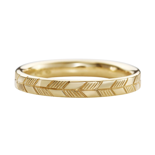 Golden Wedding Band With An Abstract Feather Engraving
