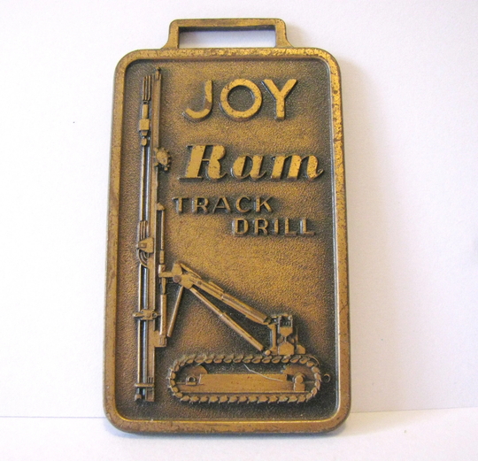 Joy Manufacturing Company Ram Track Drill Crawler Brass Pocket Watch Fob Used in Mining & Rock Quarry Construction Leavens Attleboro