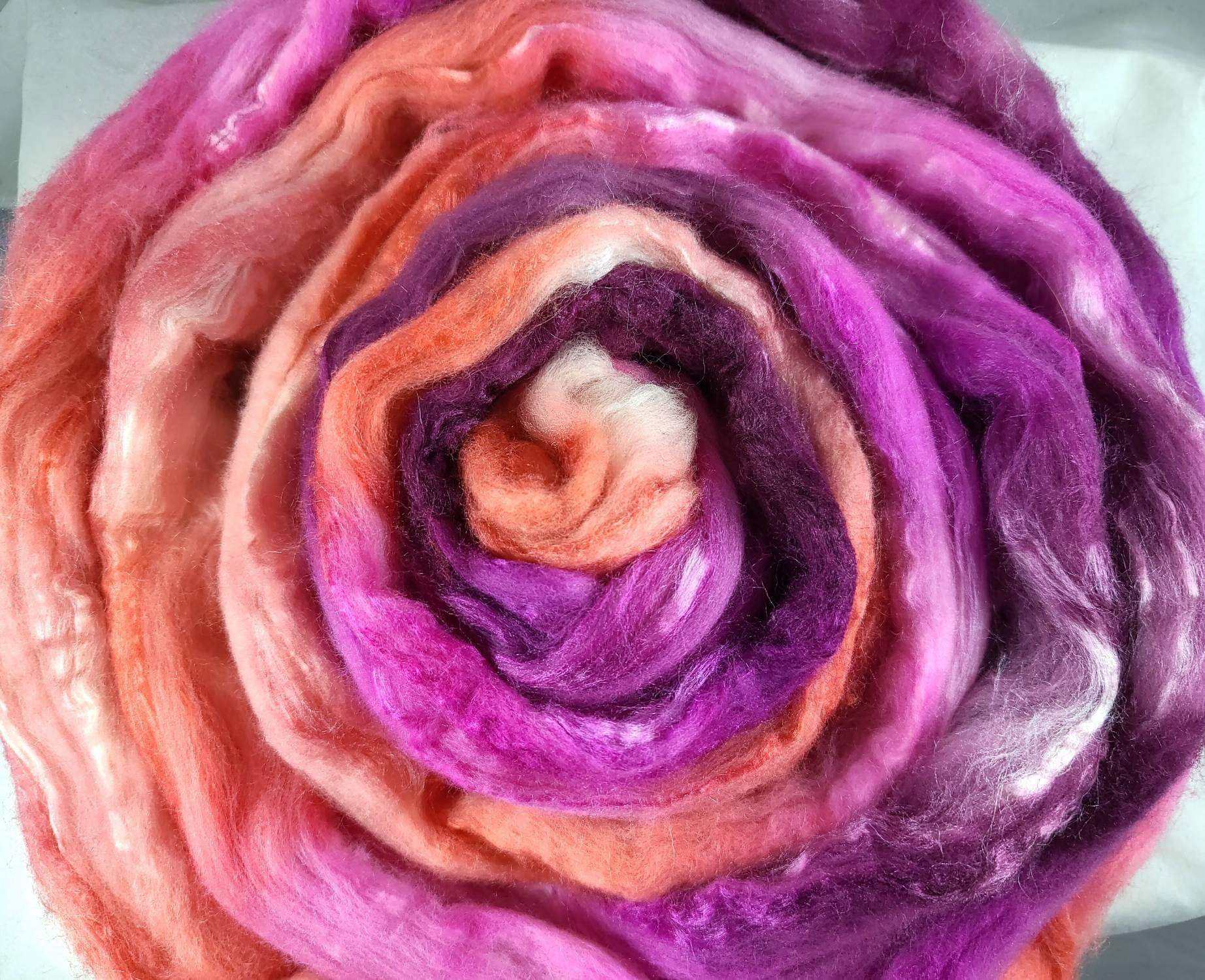 Merino Silk Blend Combed Top Spinning & Felting Fiber in Warm Shades Of Pink, Purple, & Peach With A Touch Wine Orange Sherbet
