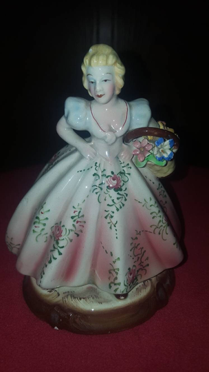 Lady Holding Flowers With Unique Makers Mark