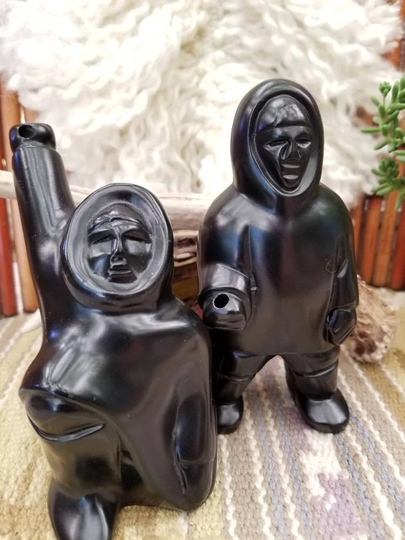 Two Pearlite Stonecraft Inuit Spear Hunters. These Glossy Black Statues, Honoring The Tribes Of Alaska, Were Handcrafted in Canada