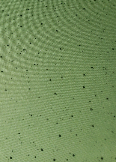 Warm Wishes Light Green With Black Speckles Christmas Blender Fabric. All Cotton. By Hannah Dale From Maywood Studio. Priced Per 1/2 Yard