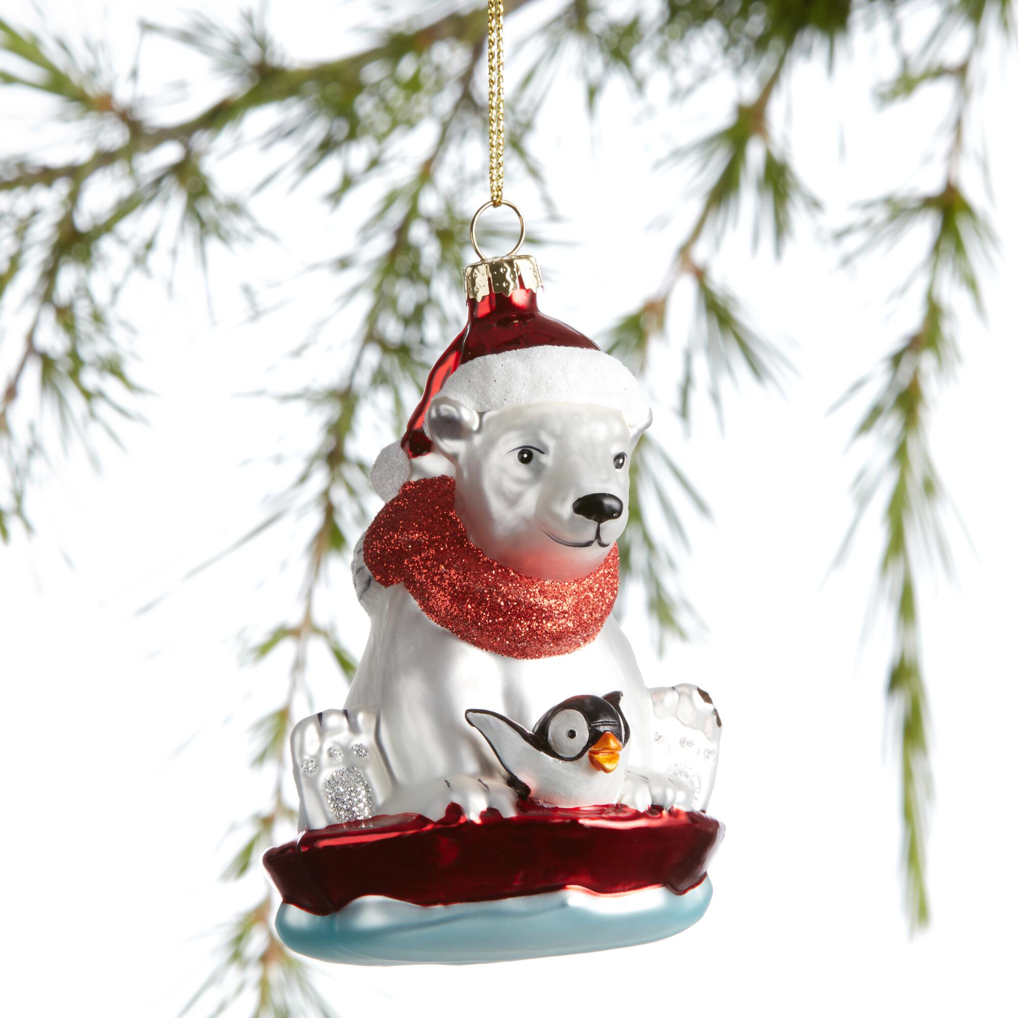 Glass Polar Bear and Penguin Sledding Ornament: White by World Market
