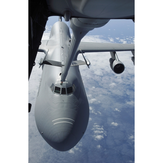July 23, 2007 - A KC-10 Extender flown by a blended crew from McGuire Air Force Base, New Jersey, prepares to refuel a C-5 Galaxy. Poster - 11 x 16