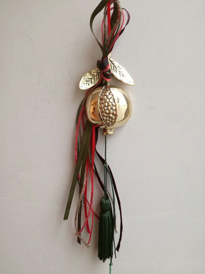 Brass Pomegranate Sculpture With Seeds, Tied Festive Ribbons, Gold Colour On A Leafy Twig, Half Fruit