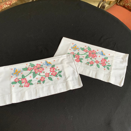 Pair Of Vintage White Poly Cotton Blend Pillowcases With Hand Cross Stitch Embroidery Pink Flowers & Blue Butterflies