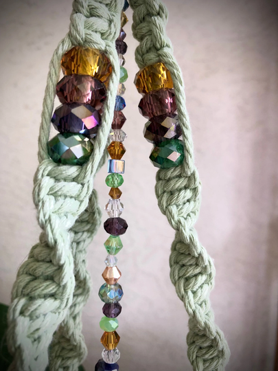 Jewel-Toned Sun Catcher Macrame Plant Hanger in Sage Green From The Garden Collection