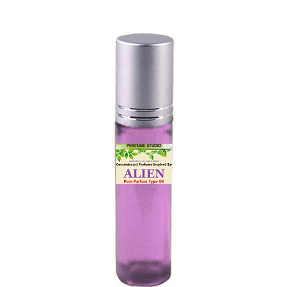 Our Premium Custom Blend Perfume Oil With Similar Base Notes To Alien For Women in A 10Ml Purple Glass Roller Bottle