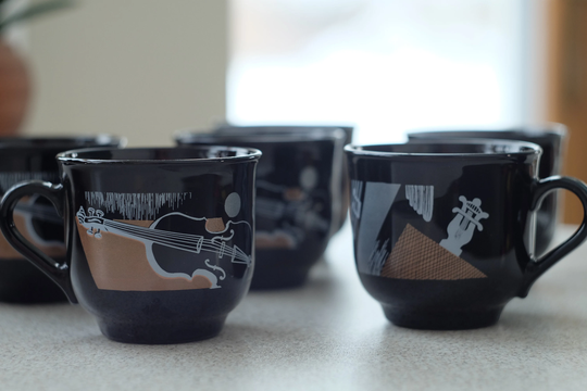 Black Glass Arcoroc Cups Featuring String Instruments