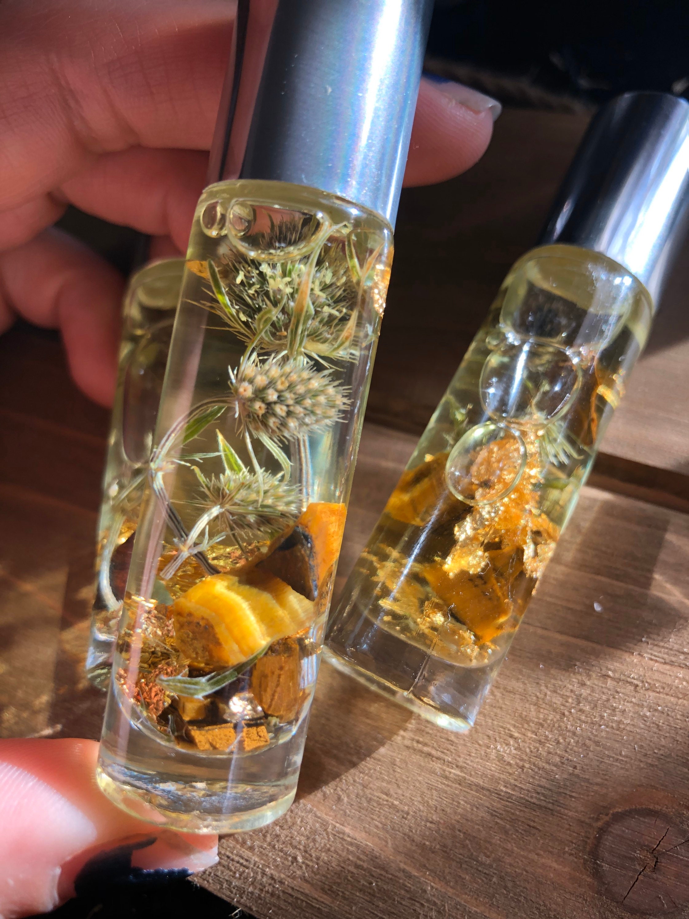 Genies Lamp Essential Oil Blend Made By Enlighten Clothing Co - Melanie Bodnar. Dried Botanicals/ Tigers Eye/ Gold Flakes