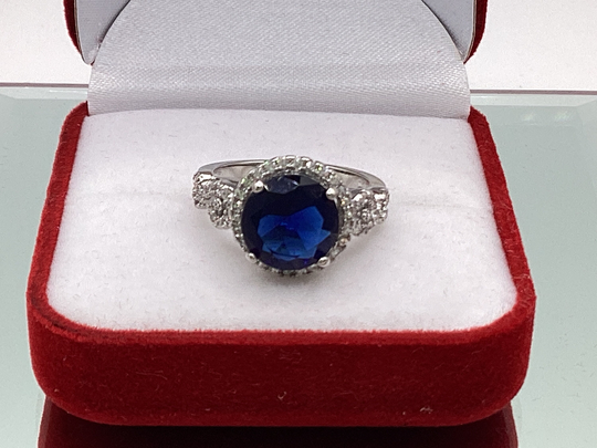 Blue Sapphire Surrounded By White Sapphires Round Halo Ring September