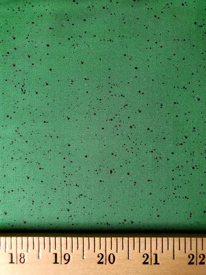 Warm Wishes Green With Tiny Black Speckles Cotton Christmas Blender Fabric From Maywood Studio. Priced Per 1/2 Yard
